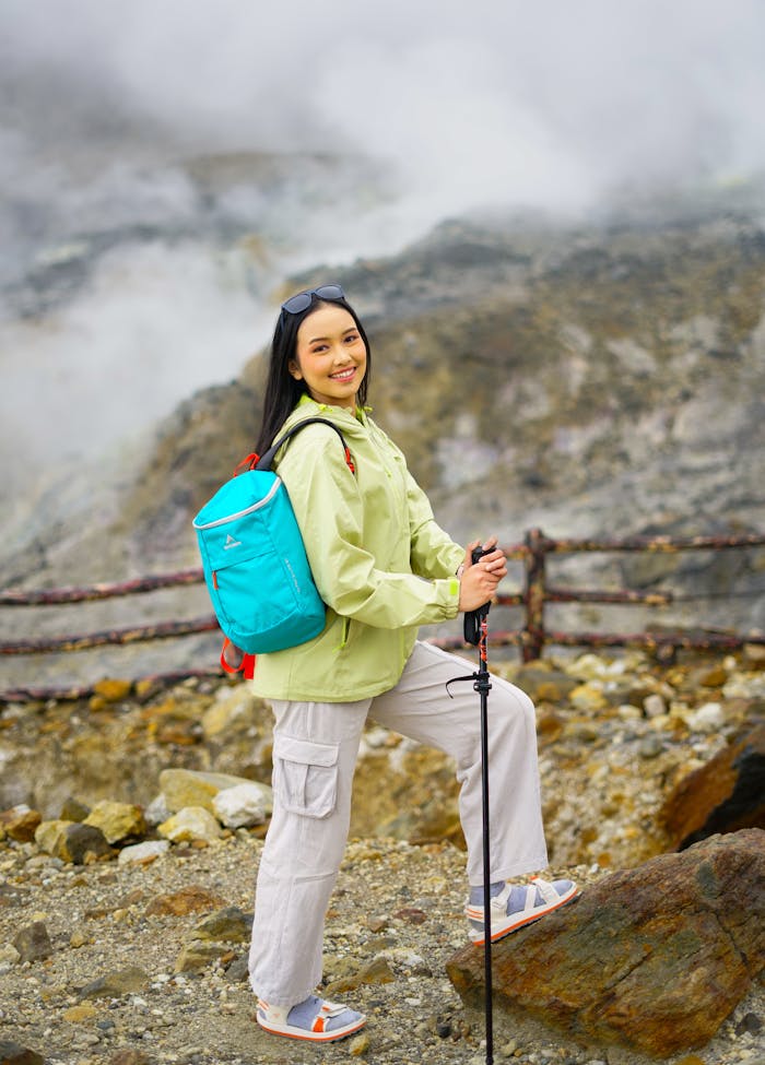 Crafting Captivating Headlines: Your awesome post title goes here Young Asian woman hiking in volcanic terrain of West Java, Indonesia. Adventure and exploration in nature.
